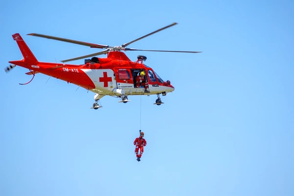 red helicopter and crew for rescue