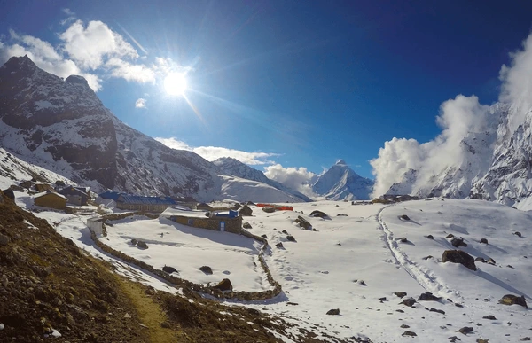 Sunny blue sky with snowy everest